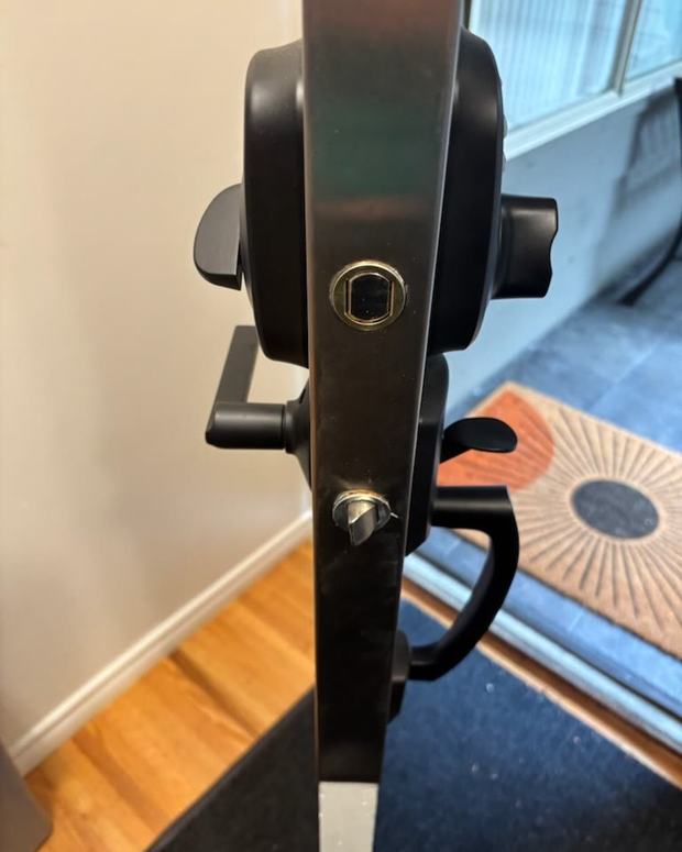 Black multi-point hardware on a glass patio door