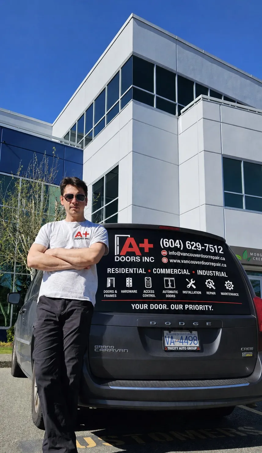A+ Doors Inc owner with the company service van, Vancouver
