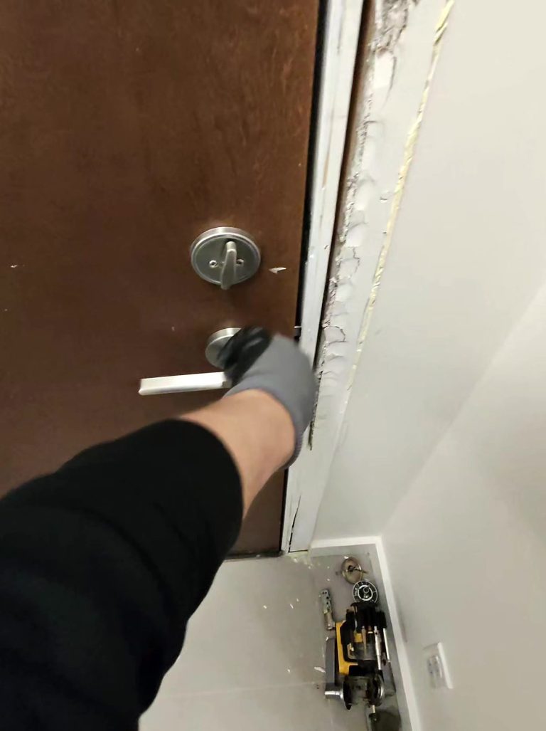 Deadbolt and lever handle installed on a newly hung brown suite door with a fresh frame