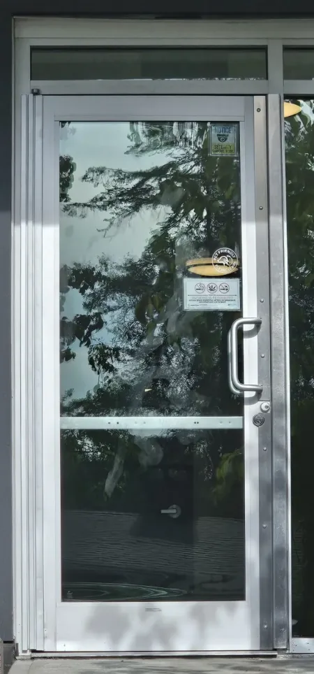 A+ Doors Inc technician performing commercial door repair