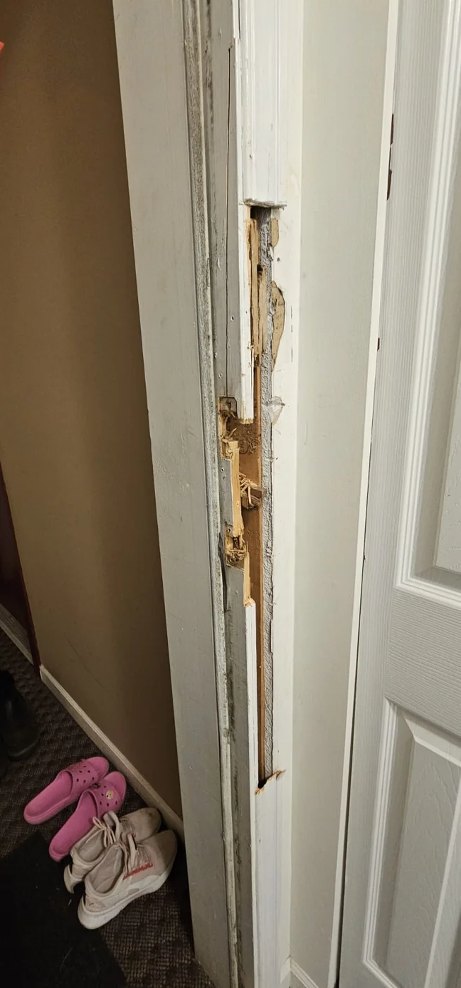 Door frame damaged by a break-in, repaired by A+ Doors Inc in Vancouver