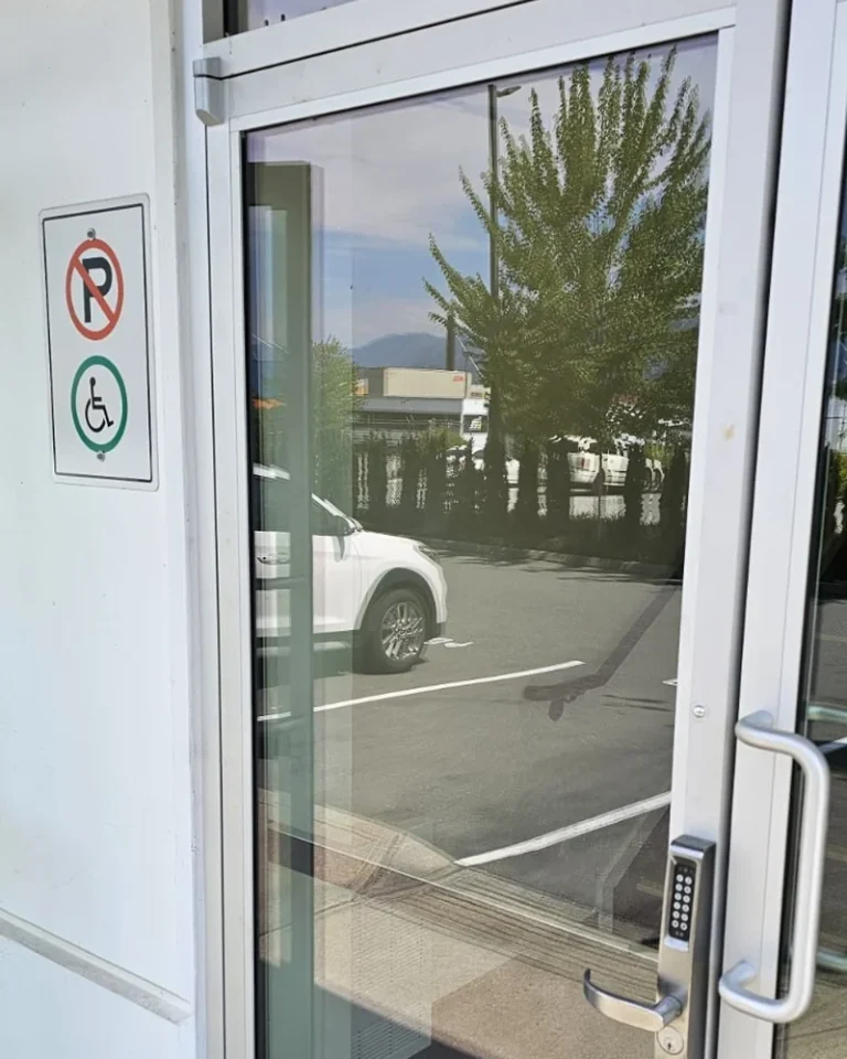Commercial storefront door with keypad access repaired by A+ Doors Inc in Vancouver